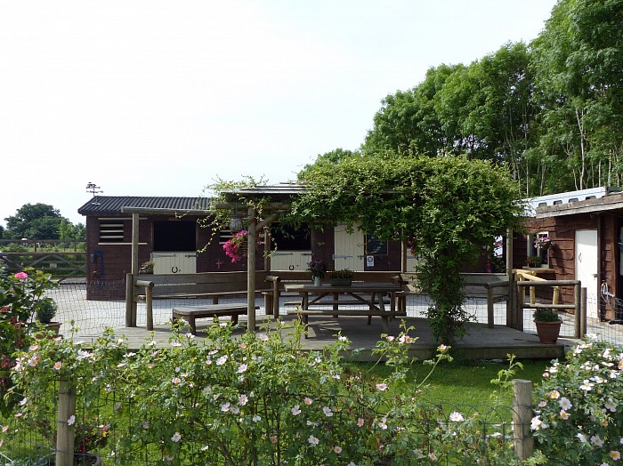 Seated decking area opposite the ménage for safe viewing