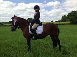 Lucy riding Milly at The llpc show